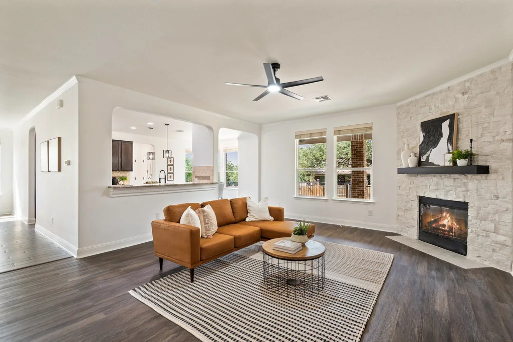 Staged Westbury living room with fireplace and open layout